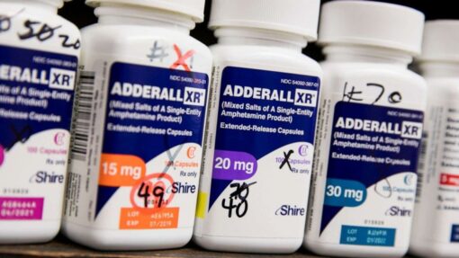 Image of Adderall pills, a prescription medication used to treat ADHD and narcolepsy, containing amphetamine salts.