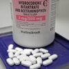 An image of hydrocodone pills, often used for pain relief, showing their typical appearance in prescription medication bottles.